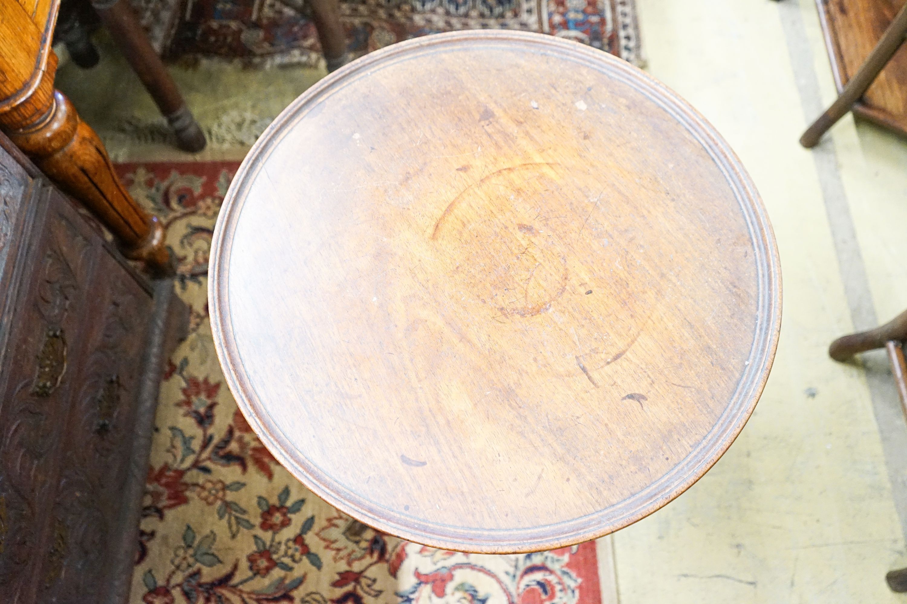 A George III mahogany tilt top tripod table, diameter 53cm, height 71cm (a.f.)